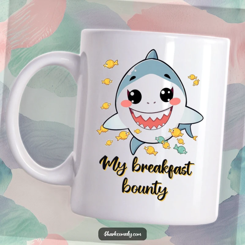 Funny mug featuring a kawaii shark with a wide grin, skillfully juggling tiny fish, embodying playful charm and culinary talent.