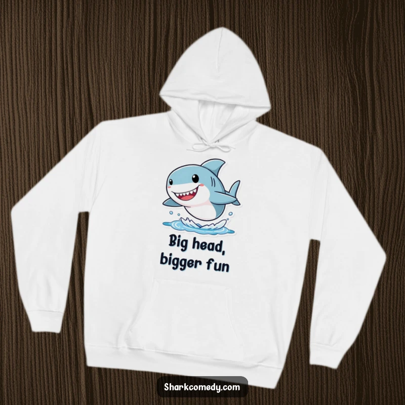 Funny shark hoodie depicting a small character with an oversized head, joyfully leaping from the water, blending comfort with whimsical humor.