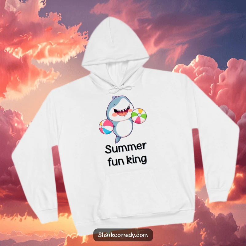 Funny smiling shark juggling beach balls, depicted on a soft hoodie, perfect for casual wear and beach lovers.