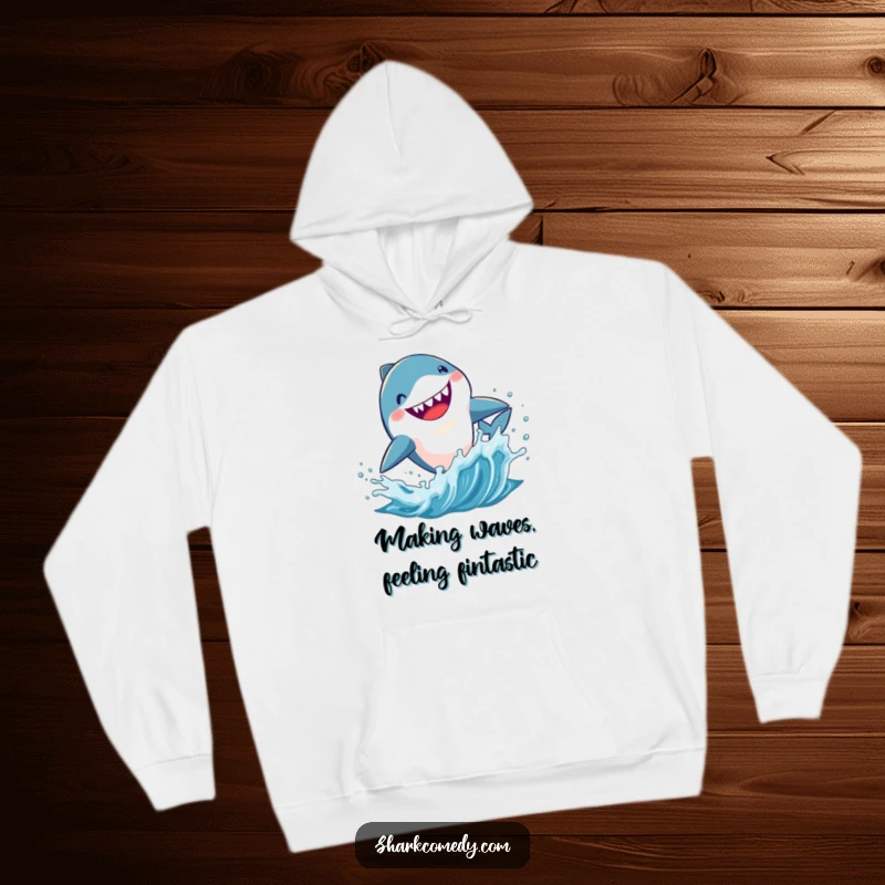 Funny Kawaii shark hoodie, a cute shark leaping energetically from splashing blue water, embodying underwater fun.