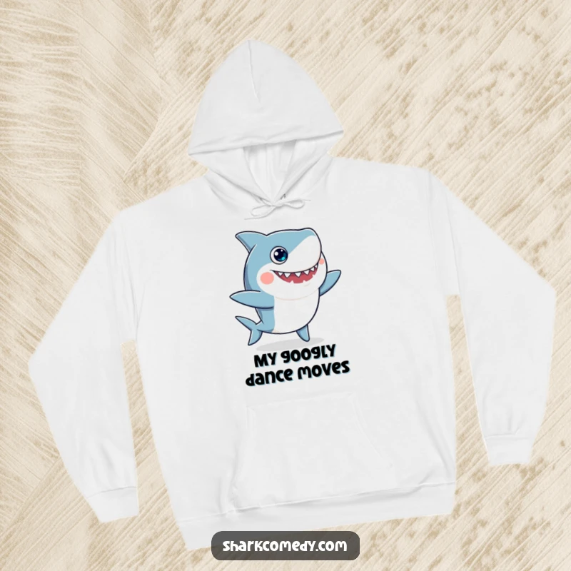 Funny hoodie showcasing a wide-eyed shark with googly eyes engaged in a whimsical, silly dance, providing warmth and laughter.