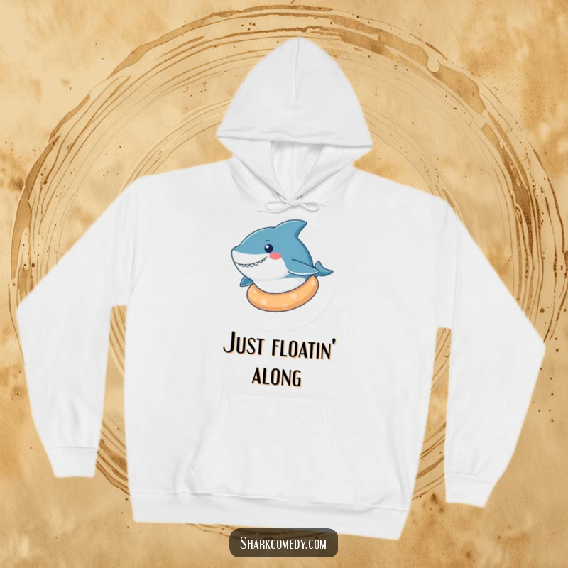 Funny kawaii shark hoodie featuring a cute shark floating serenely on a rubber ring, offering supreme comfort and relaxation.