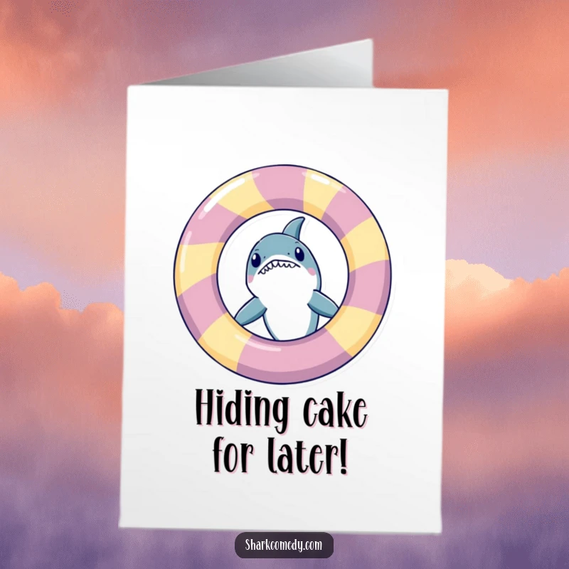 Funny Free Printable Birthday Card with a shark playfully peeking from behind a huge, colorful inflatable ring.