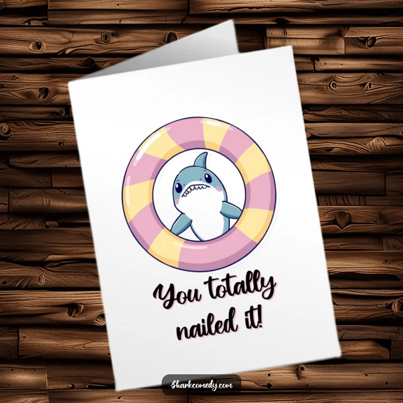 Funny Free Printable Congratulations Card featuring a shark mischievously peeking out from behind a giant inflatable ring.