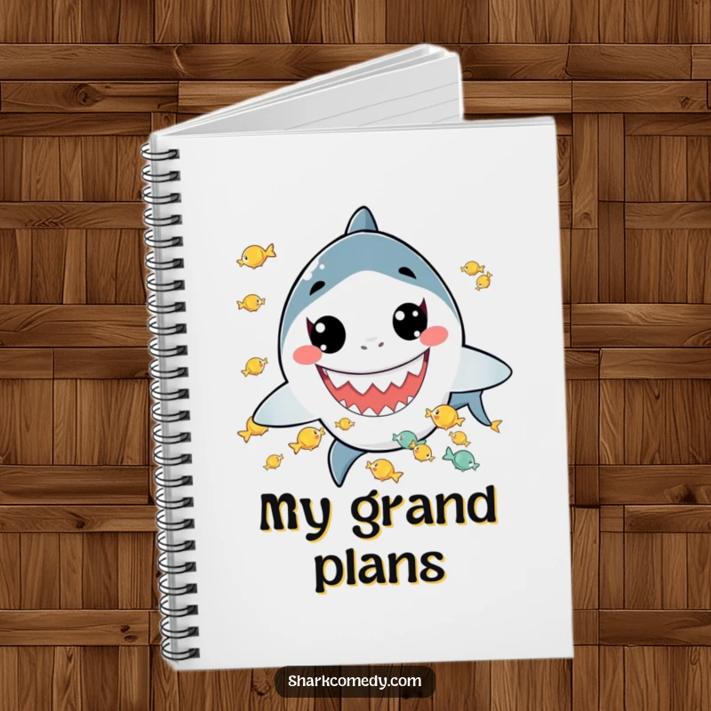 Funny notebook featuring a kawaii shark with a wide grin juggling tiny fish, perfect for jotting down notes and ideas with a playful vibe.