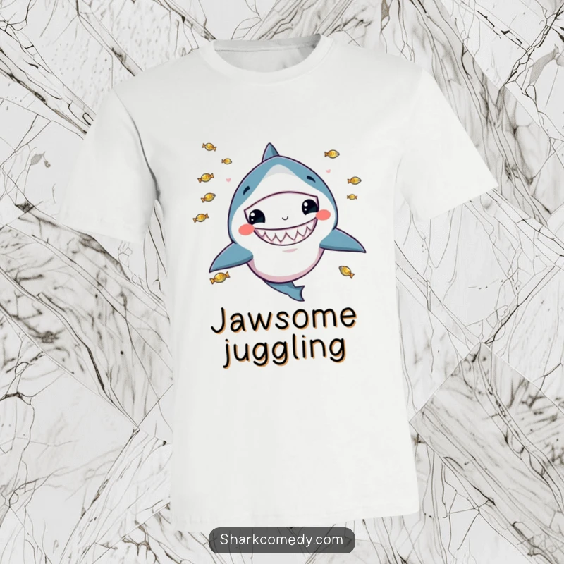 Funny t-shirt depicting a kawaii shark with a wide grin, skillfully juggling tiny fish, showcasing playful and unique humor.